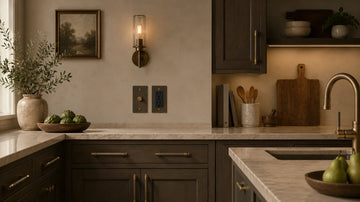 contemporary bronze and antique brass decor with matching light switches, outlets and appliance pulls across the kitchen