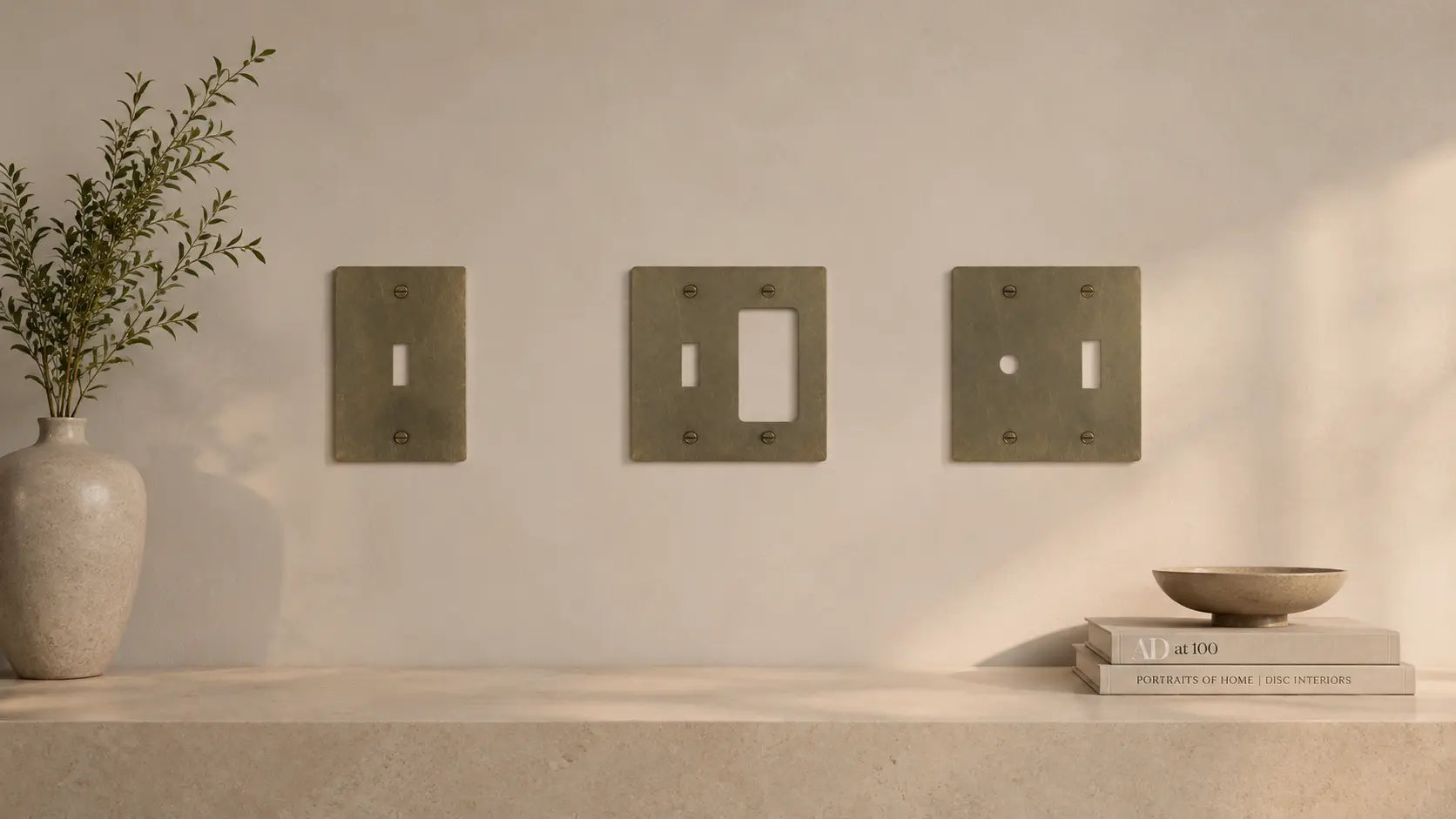 brass light switch plates in different variants - single toggle, toggle and dimmer, toggle and outlet, two toggles