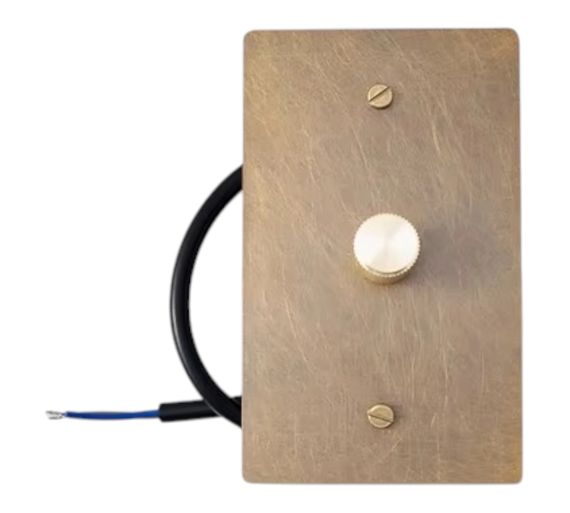 Brass light switch plate with a cable and switch on a white background