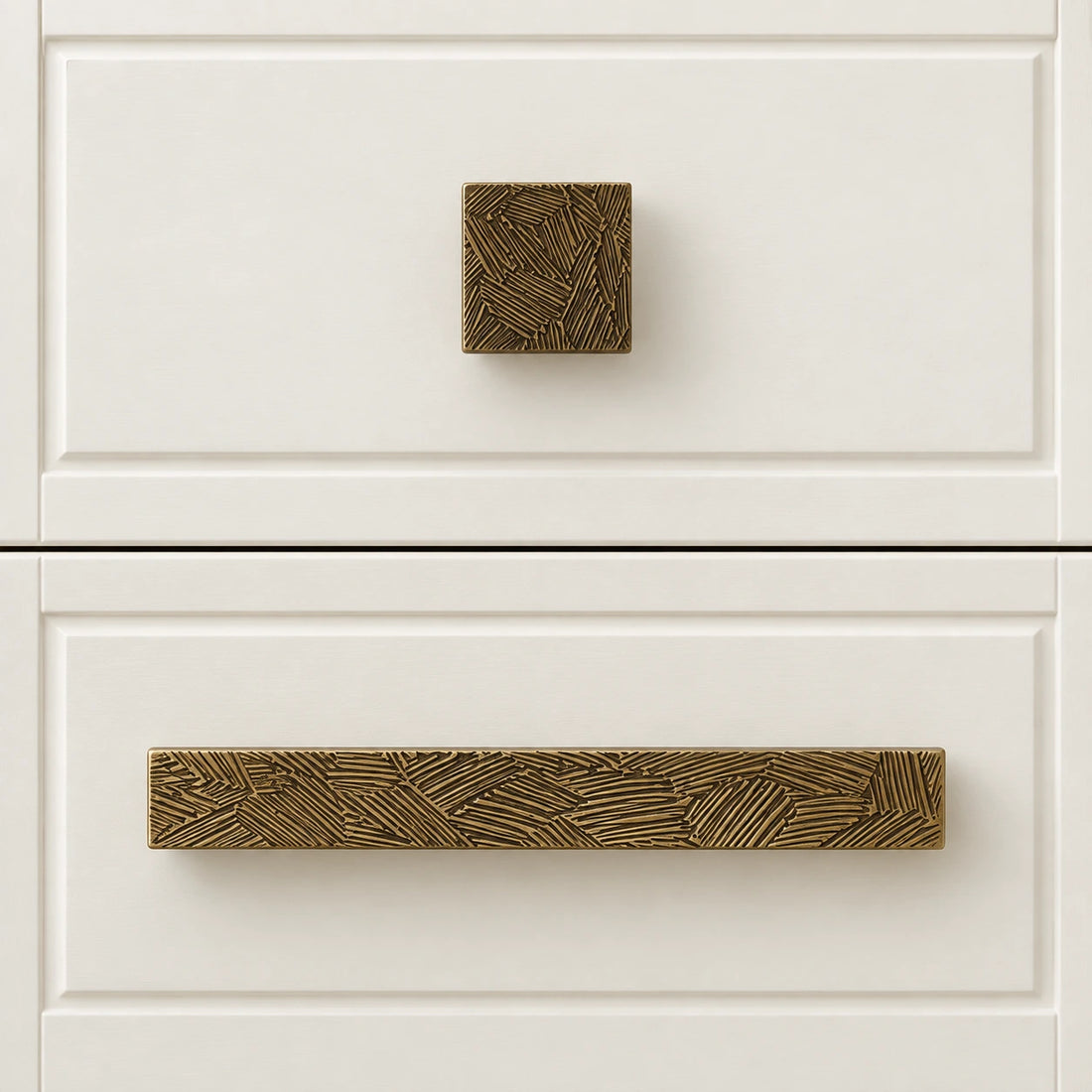 Antique brass textured cabinet pulls and square knob on limestone