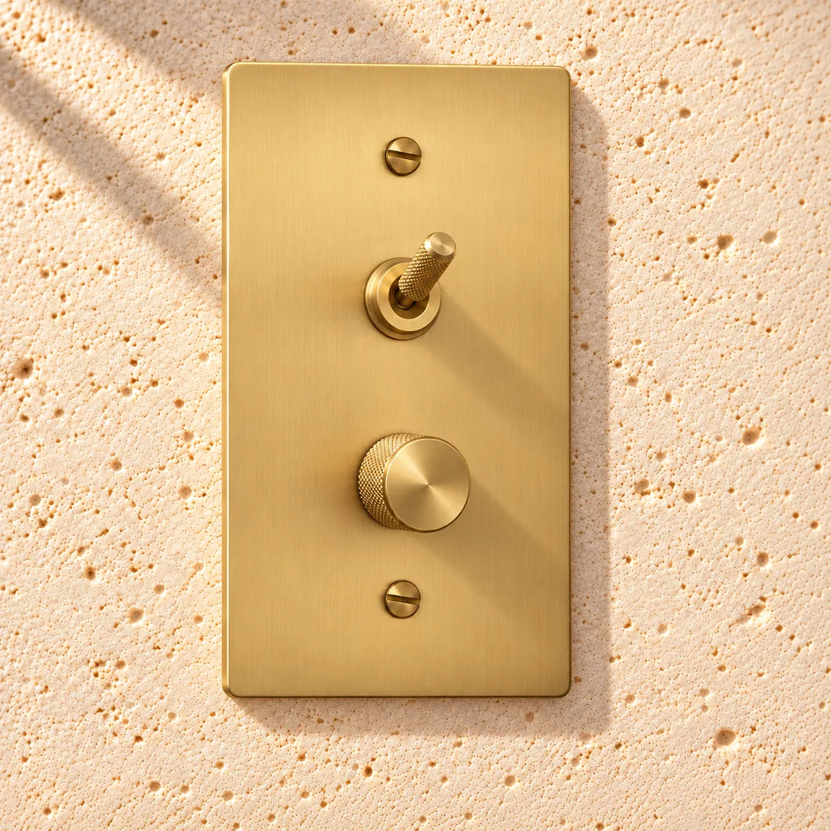 1-Gang Solid Brass Knurled Toggle Light Switch & Dimmer — Stacked in Satin Brass; stacked toggle above dimmer on a white background