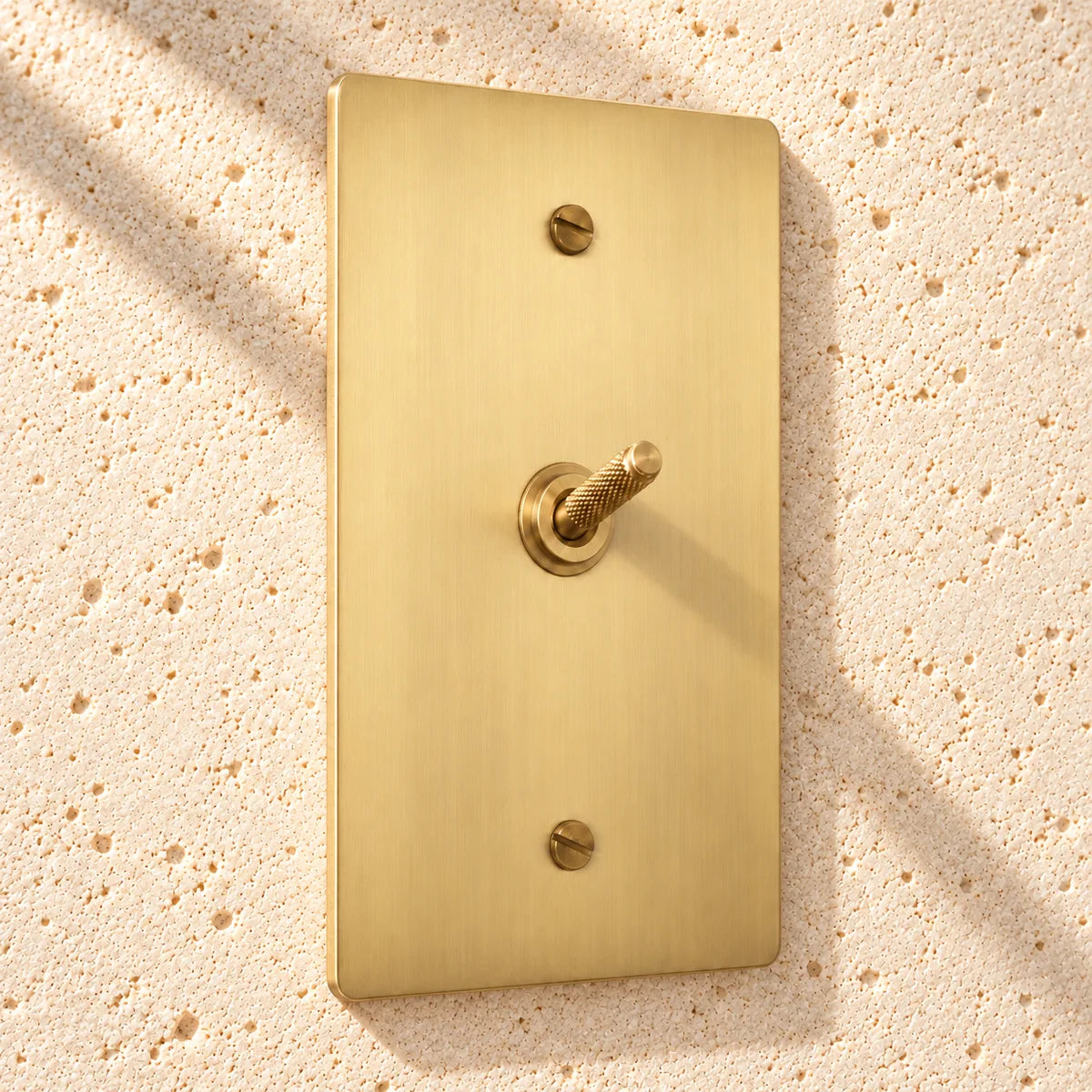 1-Gang Solid Brass Knurled Toggle Light Switch in Satin Brass; 1 toggle on a white background