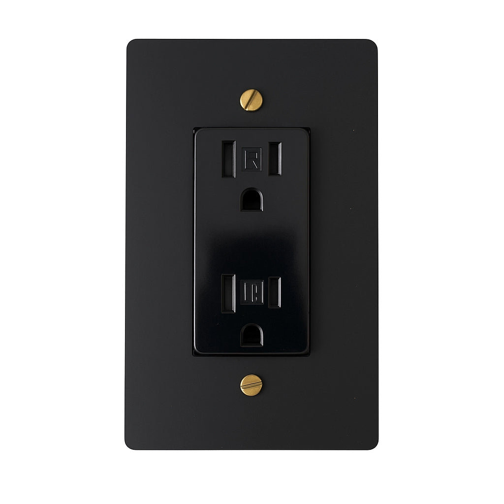 Black electrical outlet with gold screws on a white background