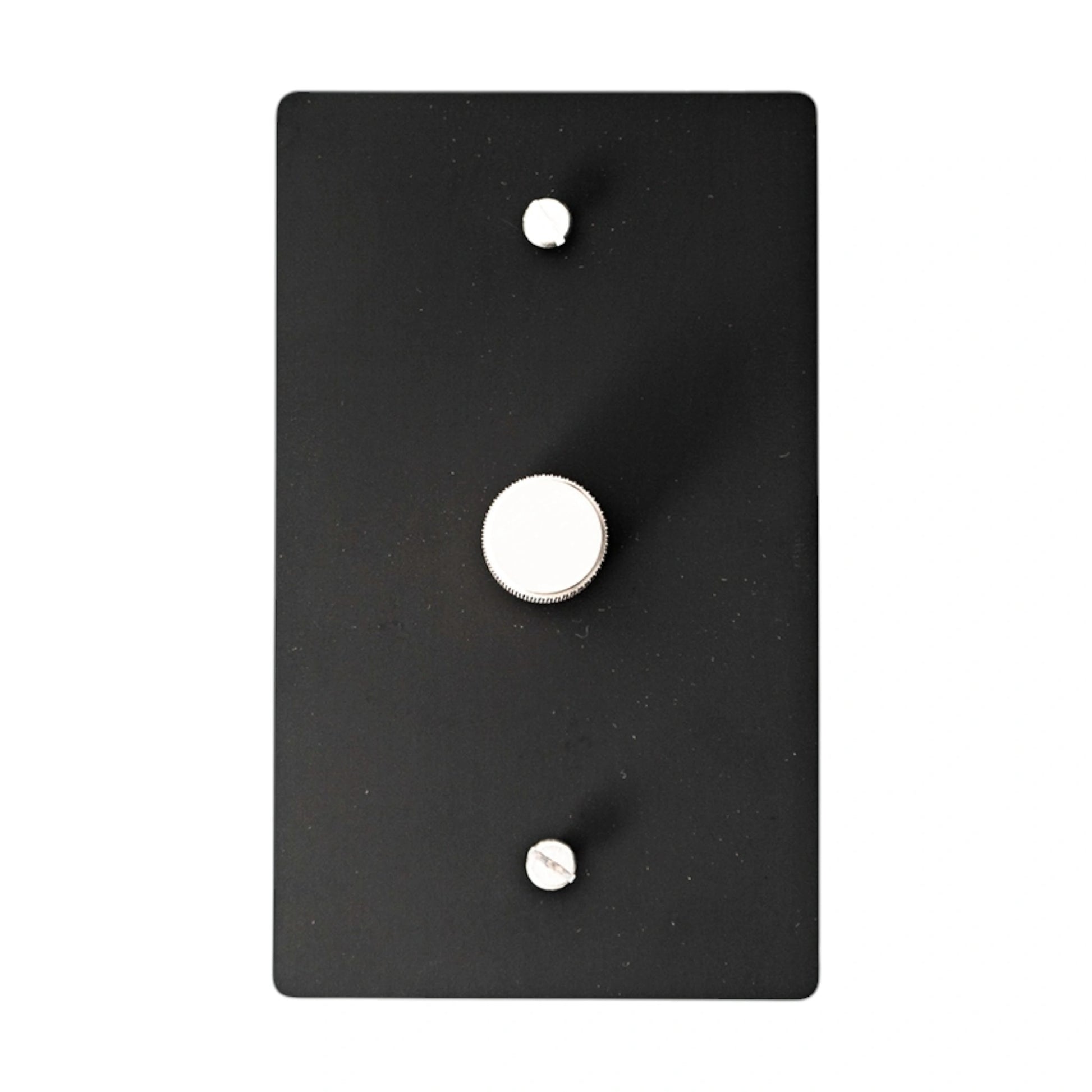 Black wall plate rotary dimmer with silver knob on a white background