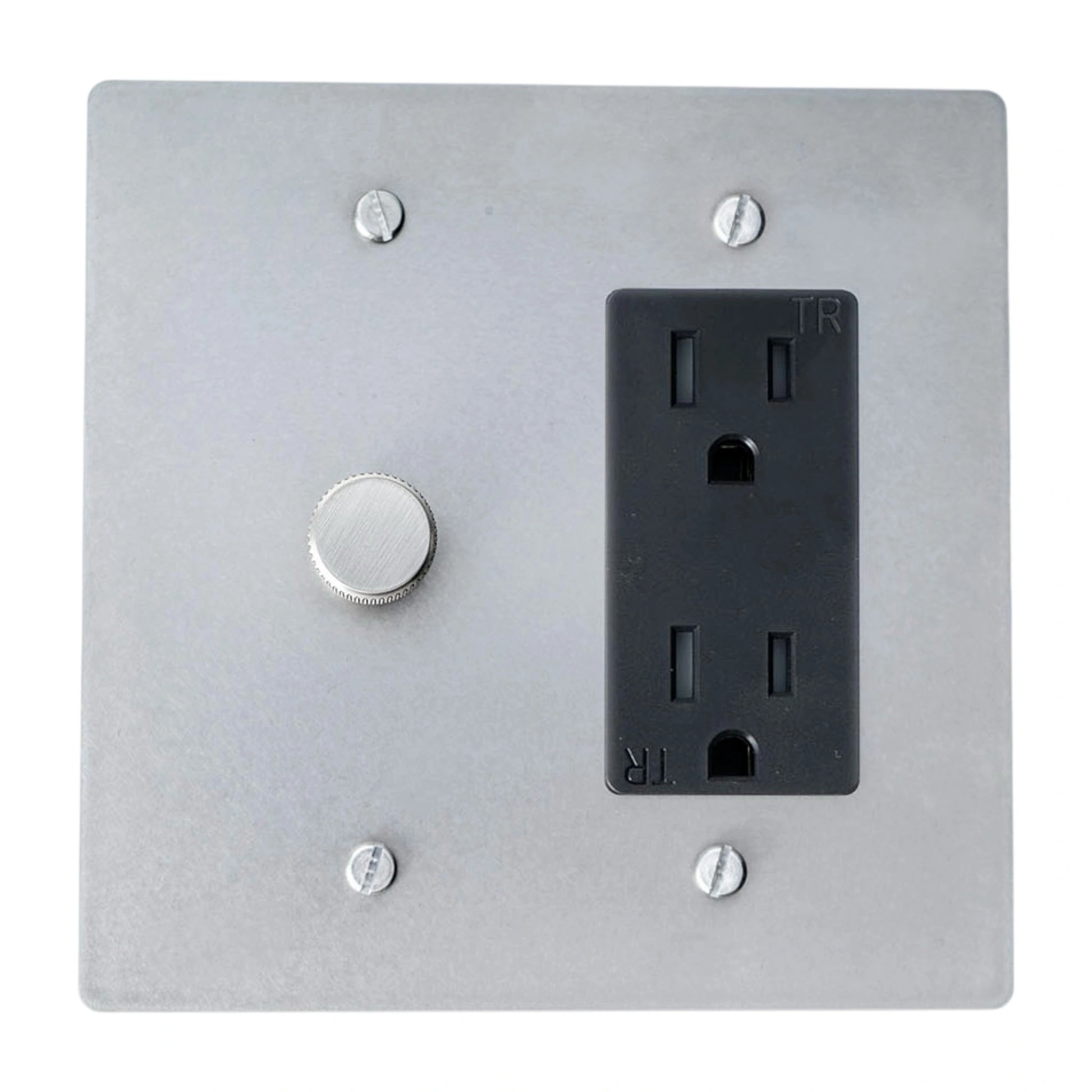 Metallic wall plate with a light switch and black electrical outlet.