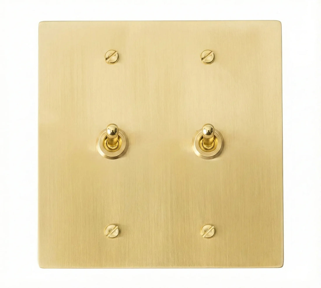 2-gang solid brass retro toggle light switch in satin brass finish, front view.