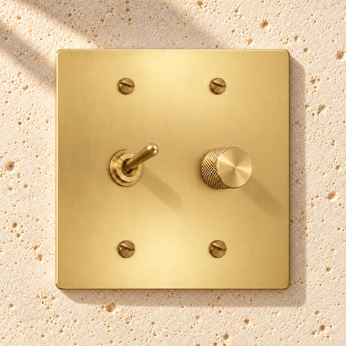 2-Gang Solid Brass Toggle Light Switch & Rotary Dimmer in Satin Brass; 1 toggle + 1 rotary dimmer on a white background