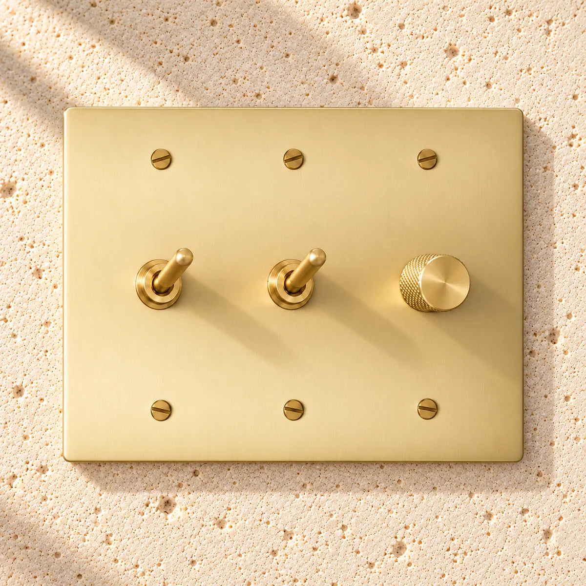 3-Gang Solid Brass 2 Toggle Light Switches & Dimmer in Satin Brass; 2 toggles + 1 rotary dimmer on a white background