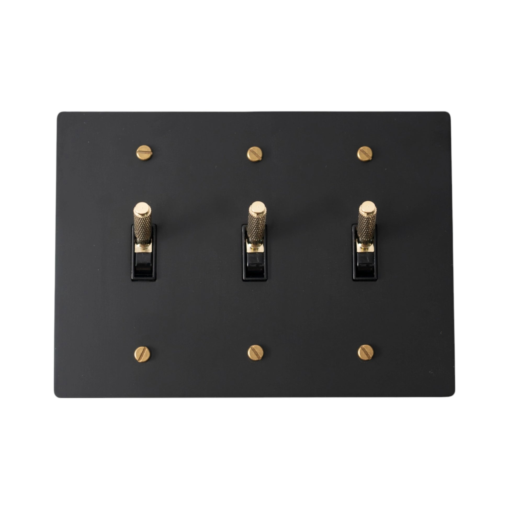 Close-up of knurled toggles on matte black 3-gang switch plate