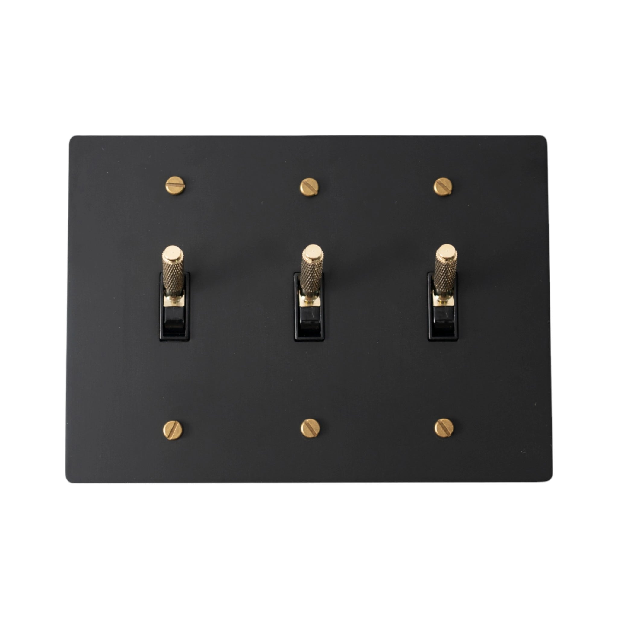 Close-up of knurled toggles on matte black 3-gang switch plate