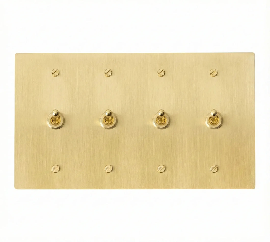 4-gang solid brass retro toggle light switch in satin brass finish, front view.