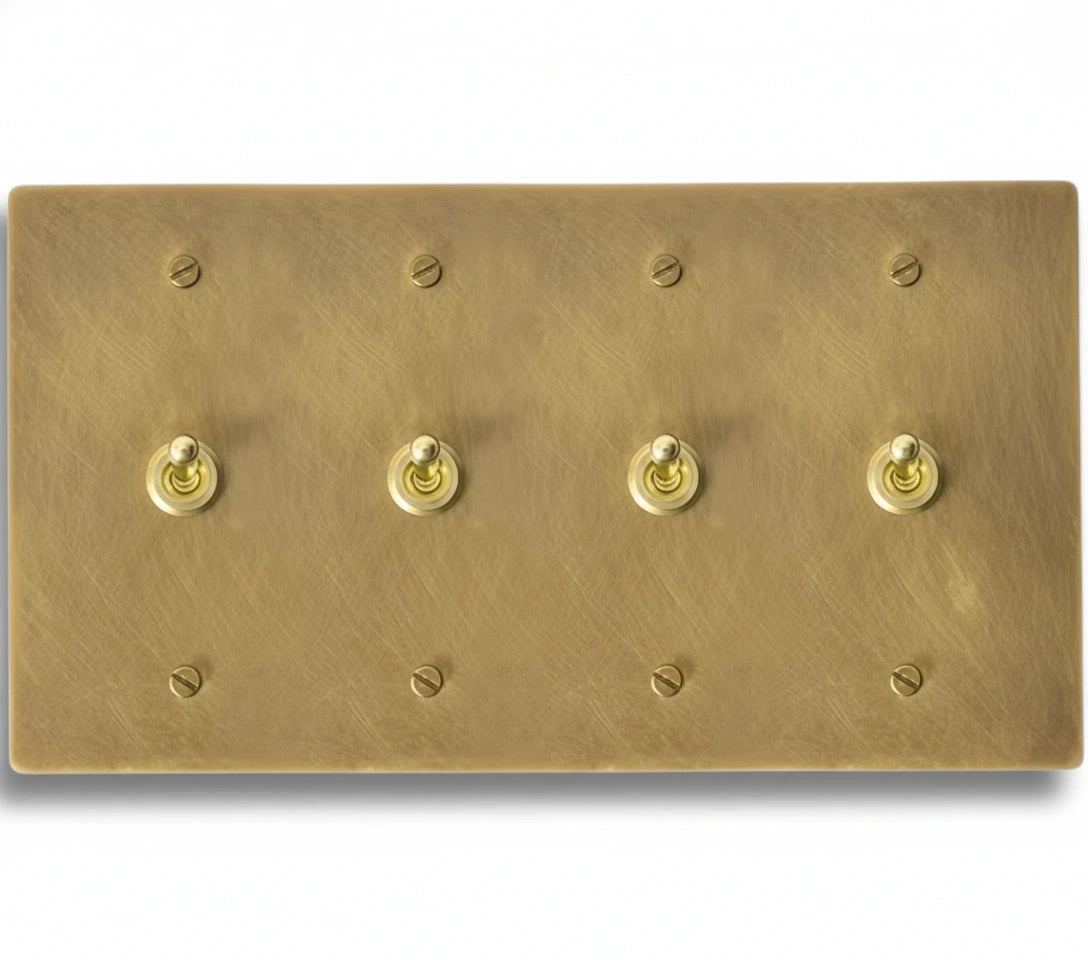 4-gang solid brass retro toggle light switch in unlacquered brass finish