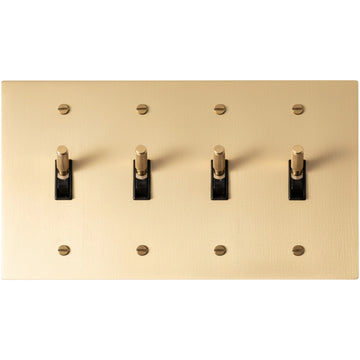 4-gang knurled toggle light switch plate in satin brass, front view
