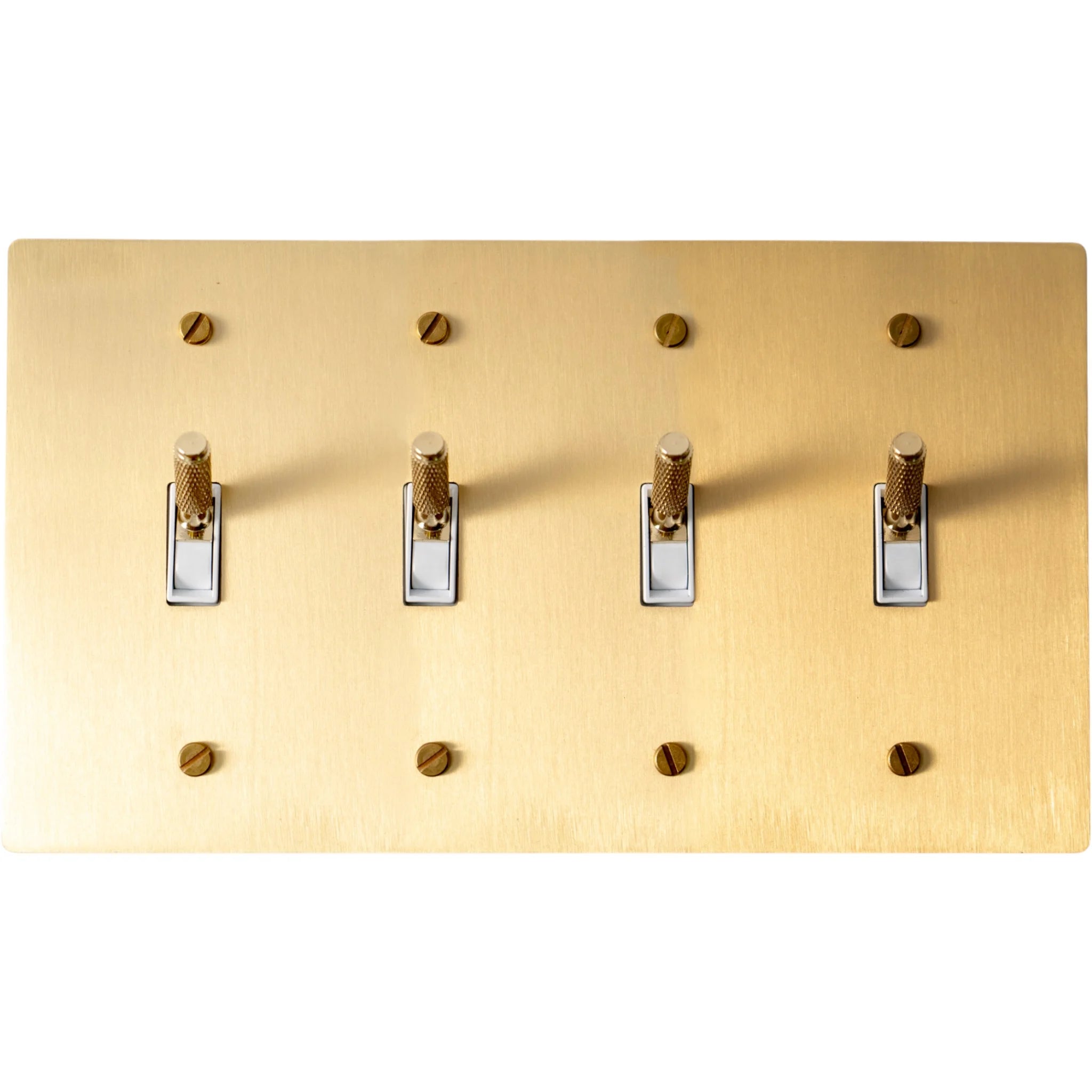Close-up of knurled toggle levers on satin brass 4-gang switch plate