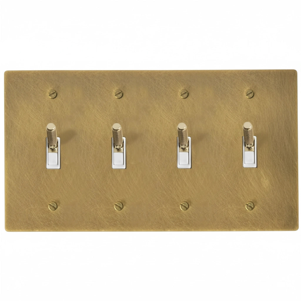 Close-up of knurled toggle detail on antique brass 4-gang switch plate