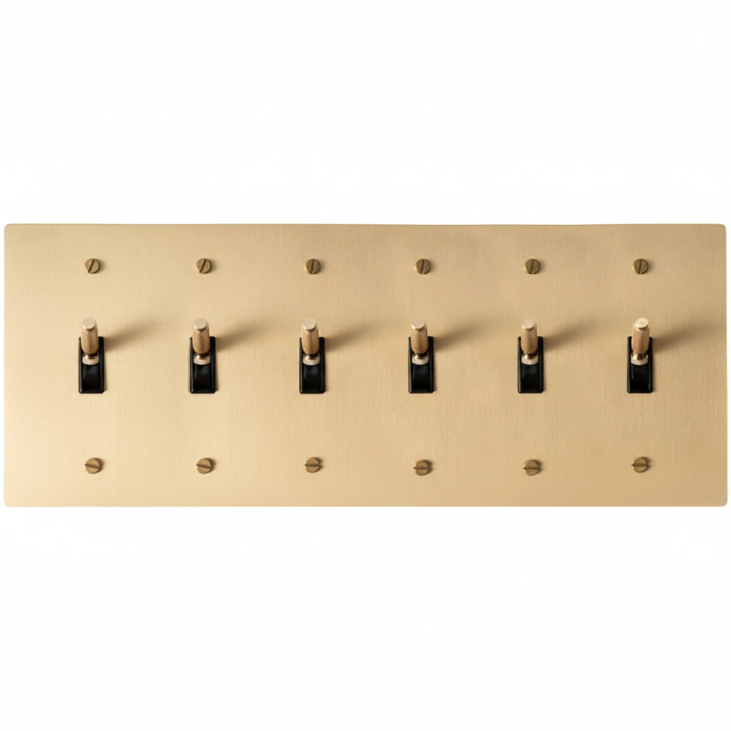 6-gang knurled toggle light switch plate in satin brass, front view