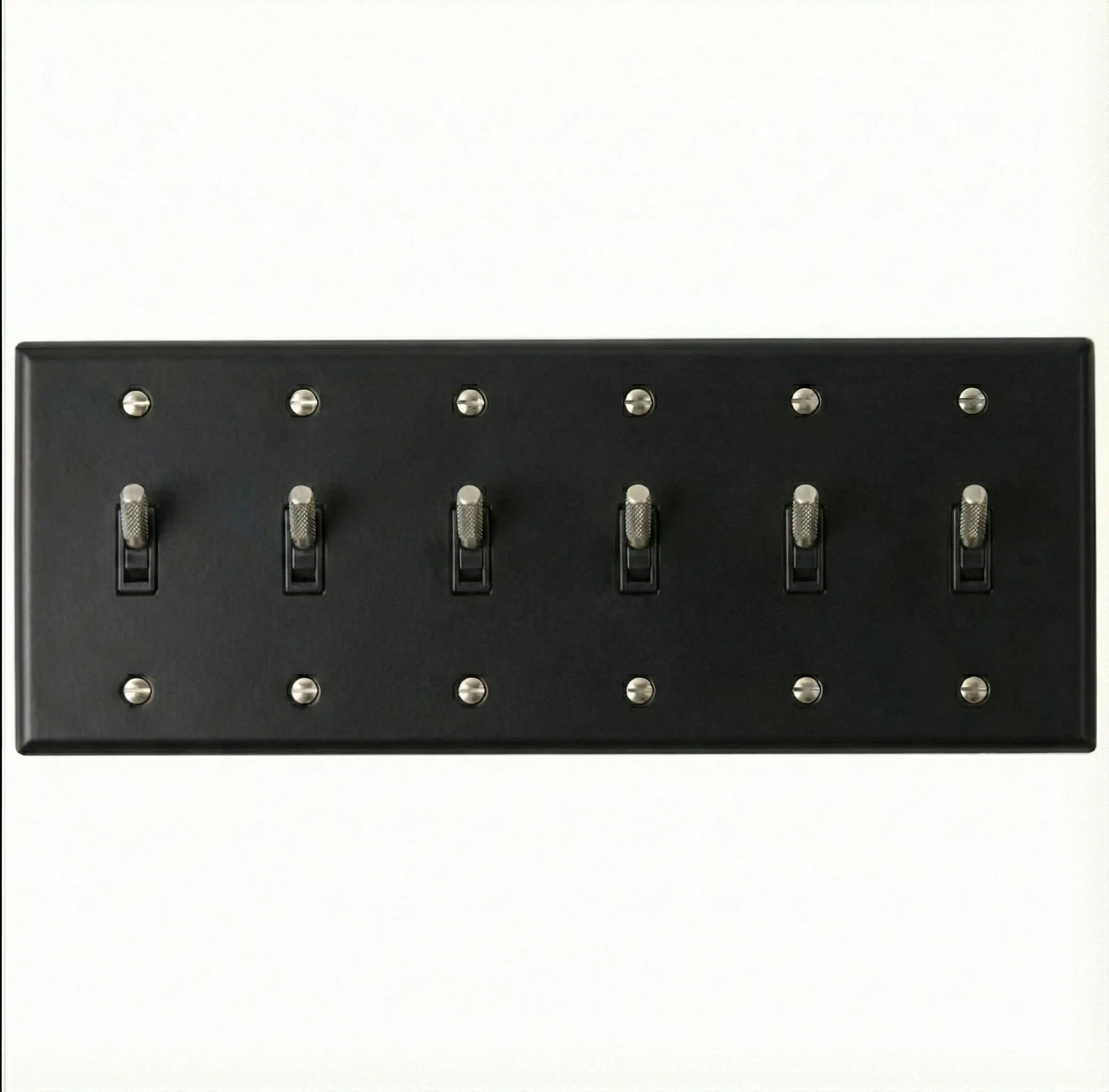 Back view of 6-gang toggle switch plate, matte black finish, mounting hardware visible