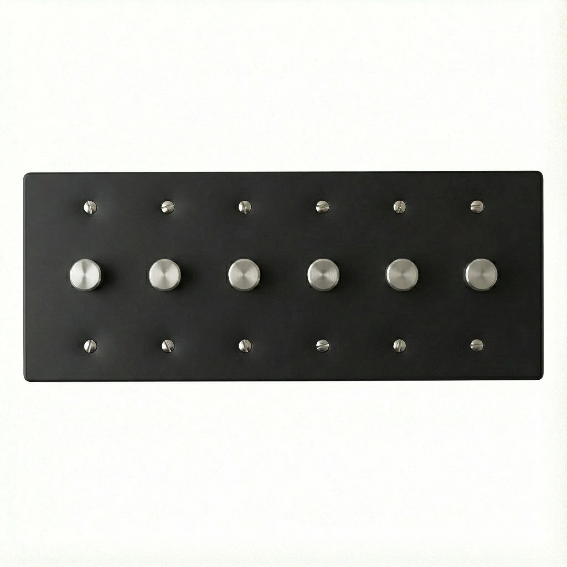 Black rotary dimmer rectangular plate with silver knobs on a white background