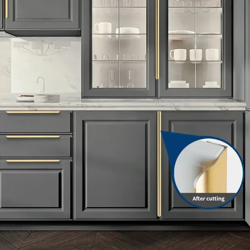 Grey kitchen cabinets with gold aluminum edge pulls and a close-up of a cabinet door.
