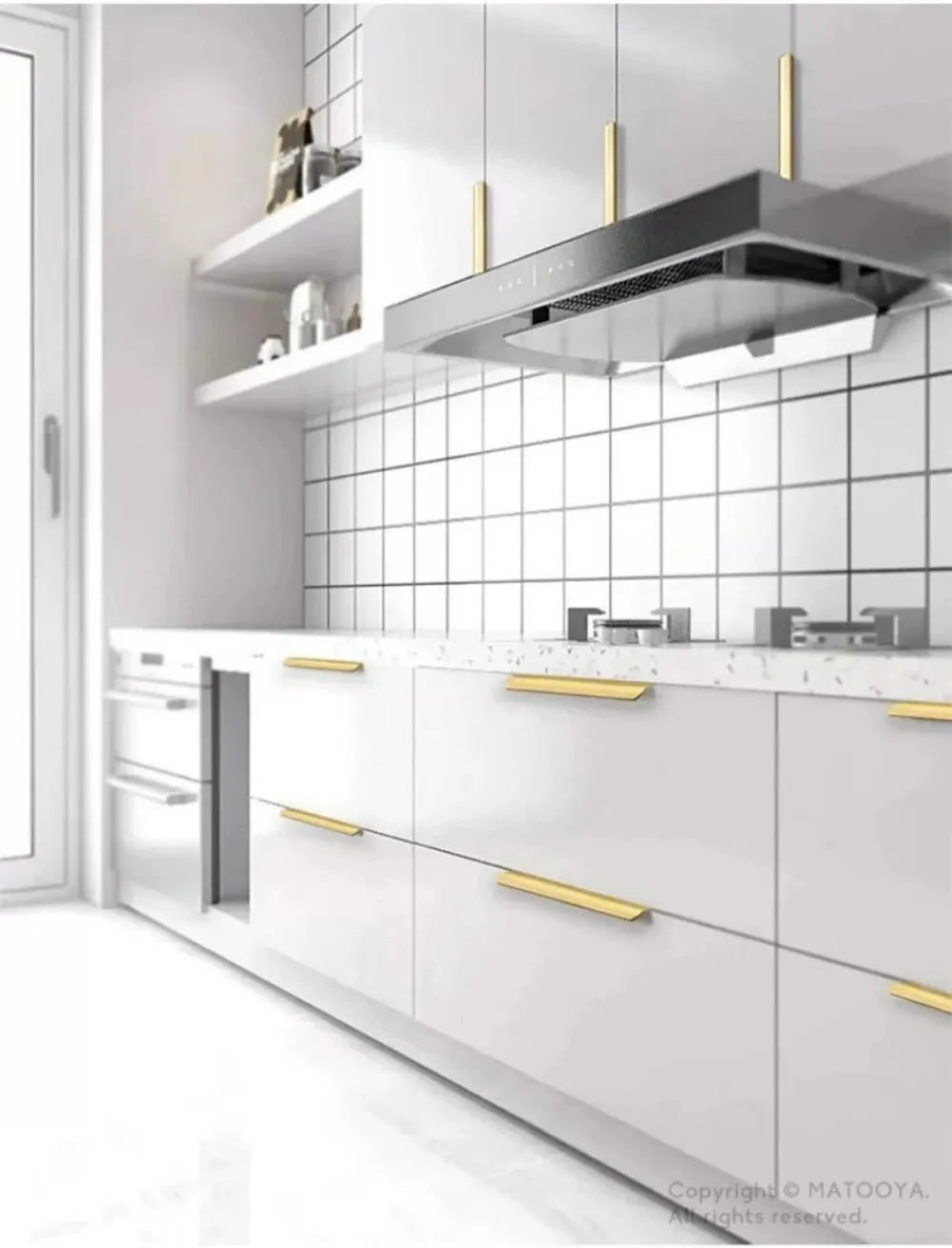 Modern kitchen with white cabinets, gold edge pulls, and a tiled backsplash.