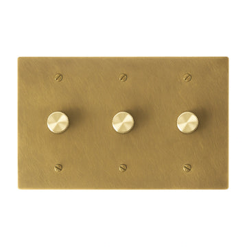 Three gang OB antique brushed brass dimmer switch with smooth brass control knobs and vintage finish.