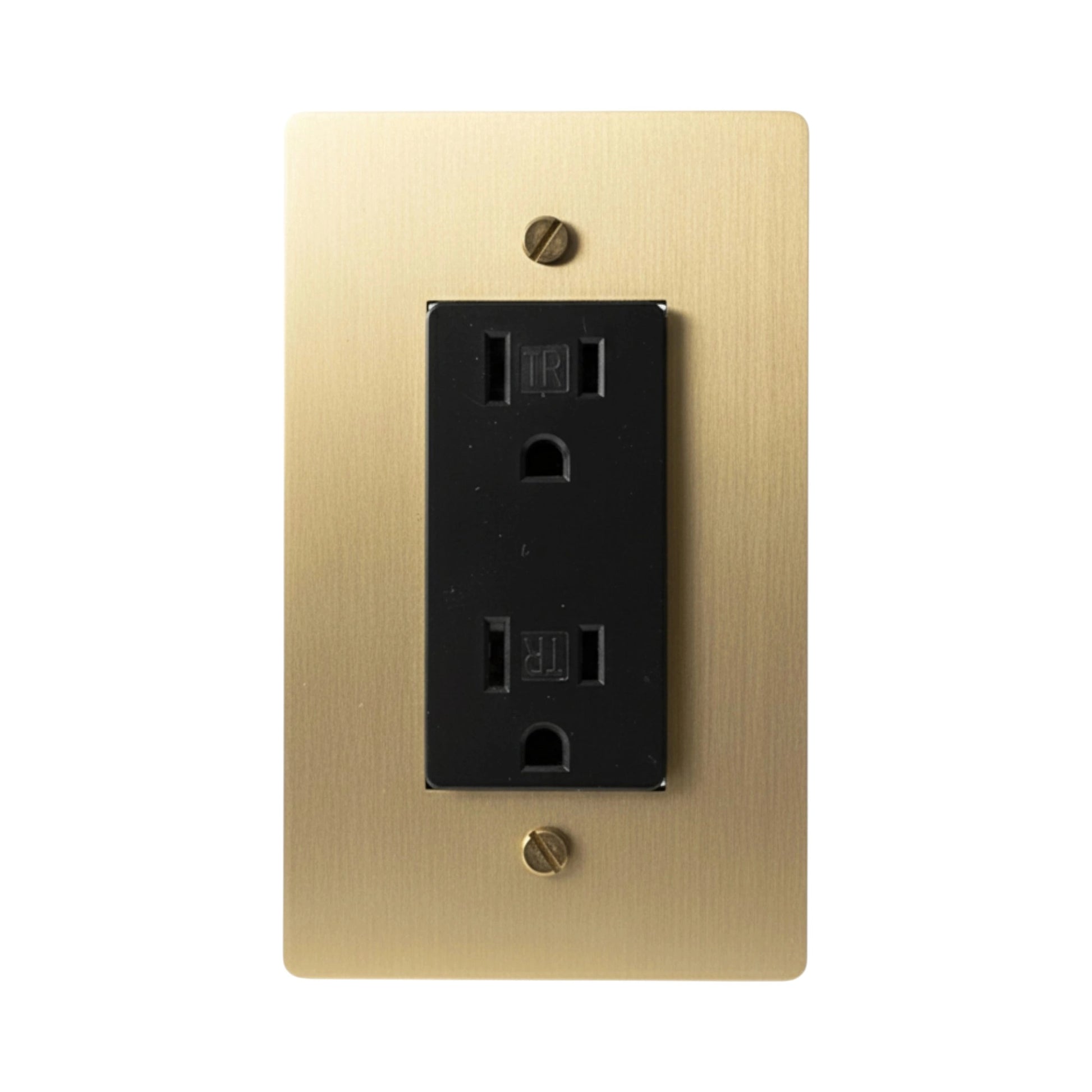 Black electrical outlet on a gold wall plate with screws