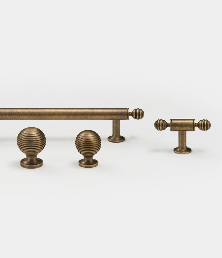 Set of vintage-style solid brass antique balls cabinet knob, t-bar and long pull on a white background.