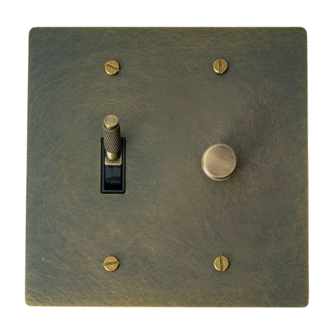 Antique brass switch plate with a toggle switch and rotary dimmer on a white background