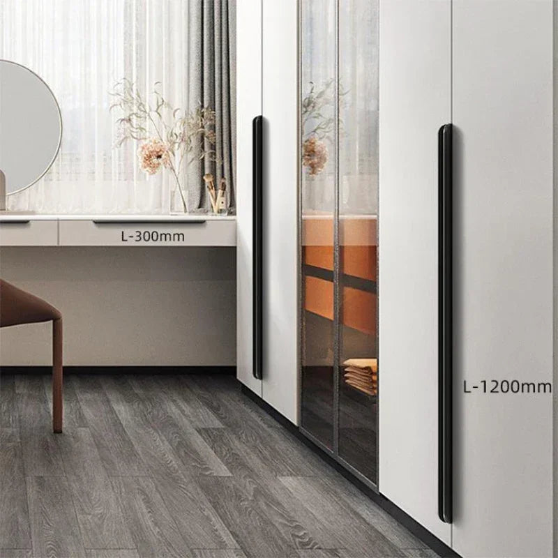 Modern interior design with a wardrobe and desk, featuring dimensions of  300mm and 1200mm of aluminum edge pulls.