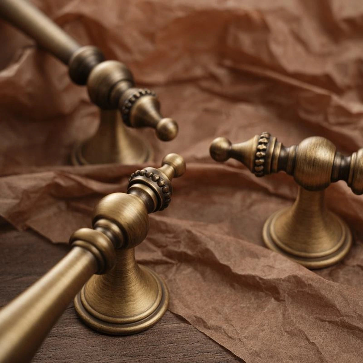 Turned posts and beaded finial details on antique brass cabinet pulls