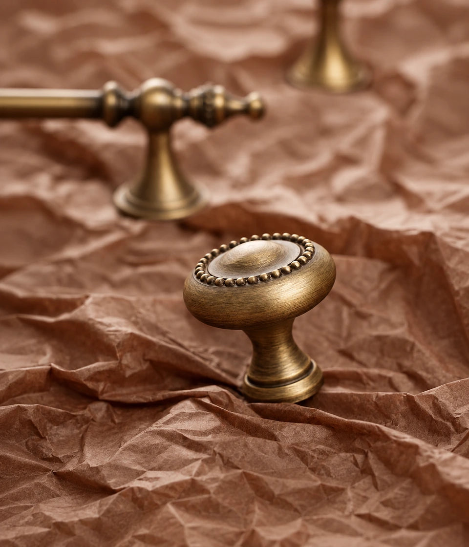 Close-up of the beaded round cabinet knob in antique brushed brass
