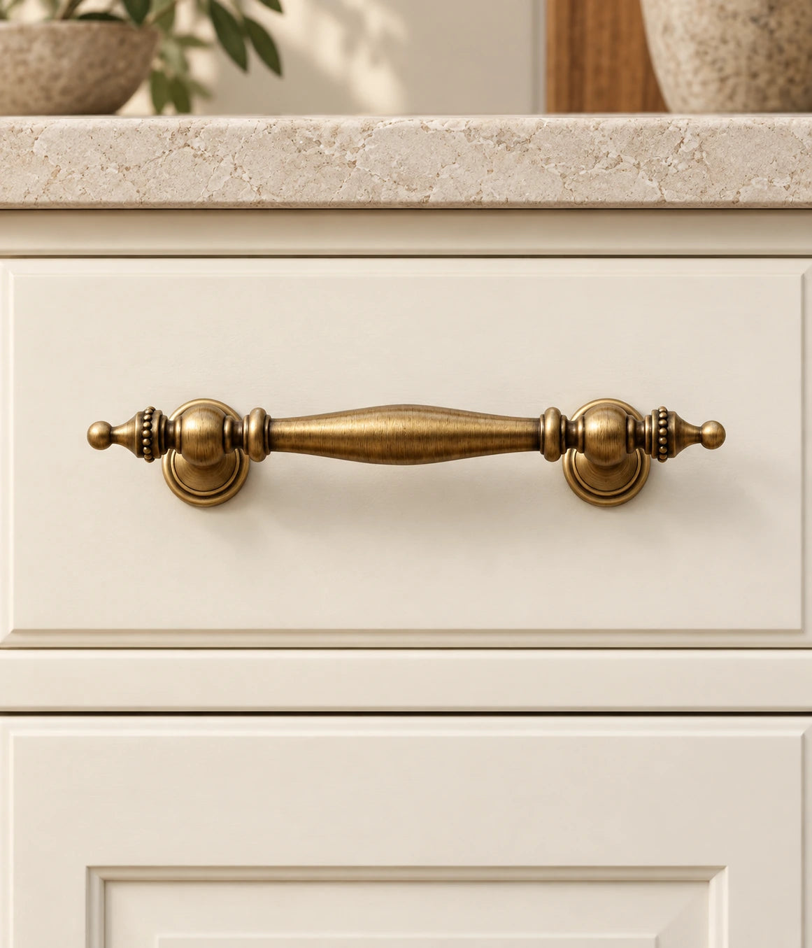 Antique Brass Beaded Spindle Pulls, Cup Pull & Knob installed on an ivory cabinet drawer