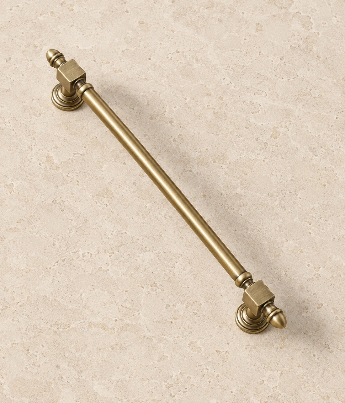 Antique Brass Block-End Cabinet Pulls & T-Knob on warm ivory limestone