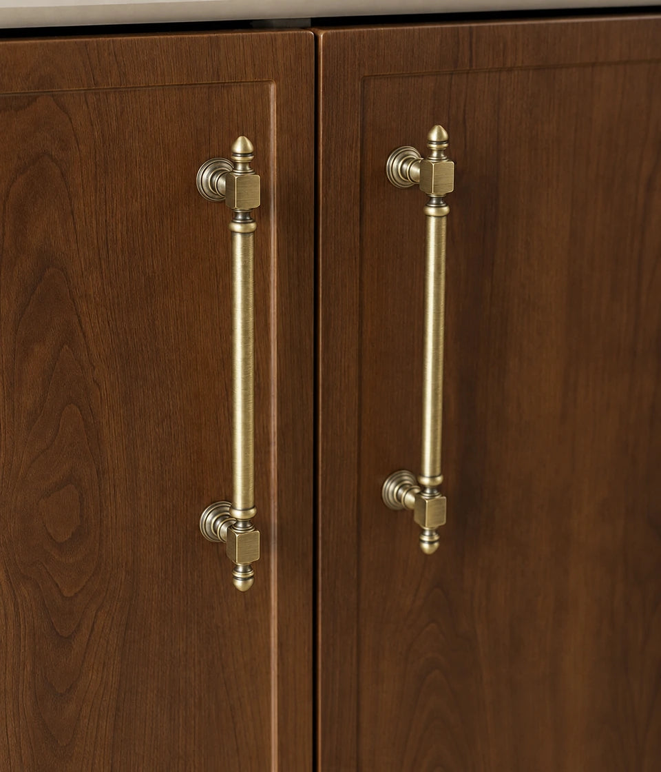 Antique brass Block-End cabinet pulls installed vertically on dark wooden doors