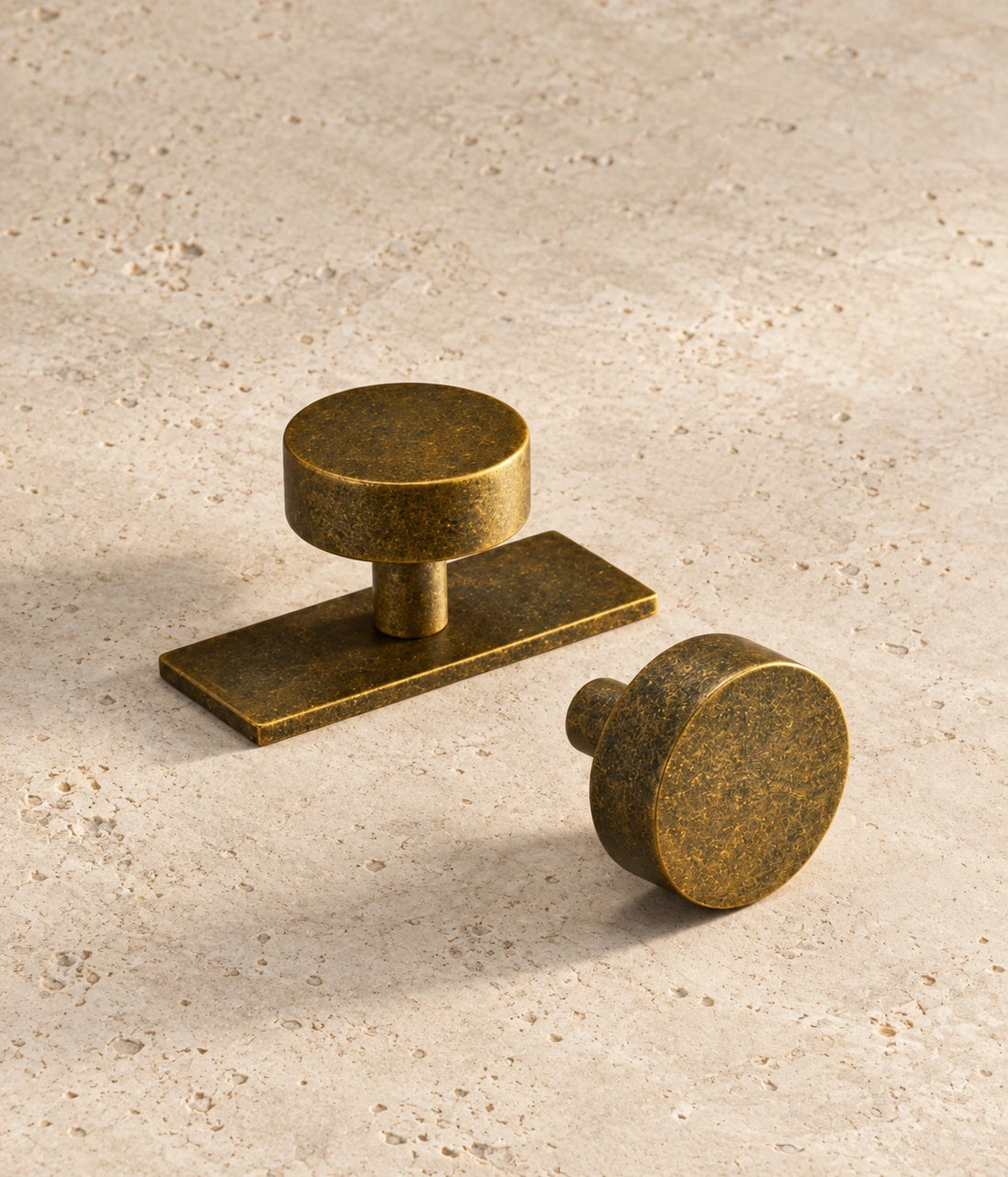 Antique Brass Cabinet Knob – Ice Flower Vintage Design arranged on warm limestone