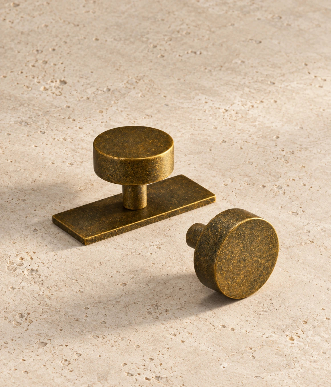 Antique Brass Cabinet Knob – Ice Flower Vintage Design arranged on warm limestone