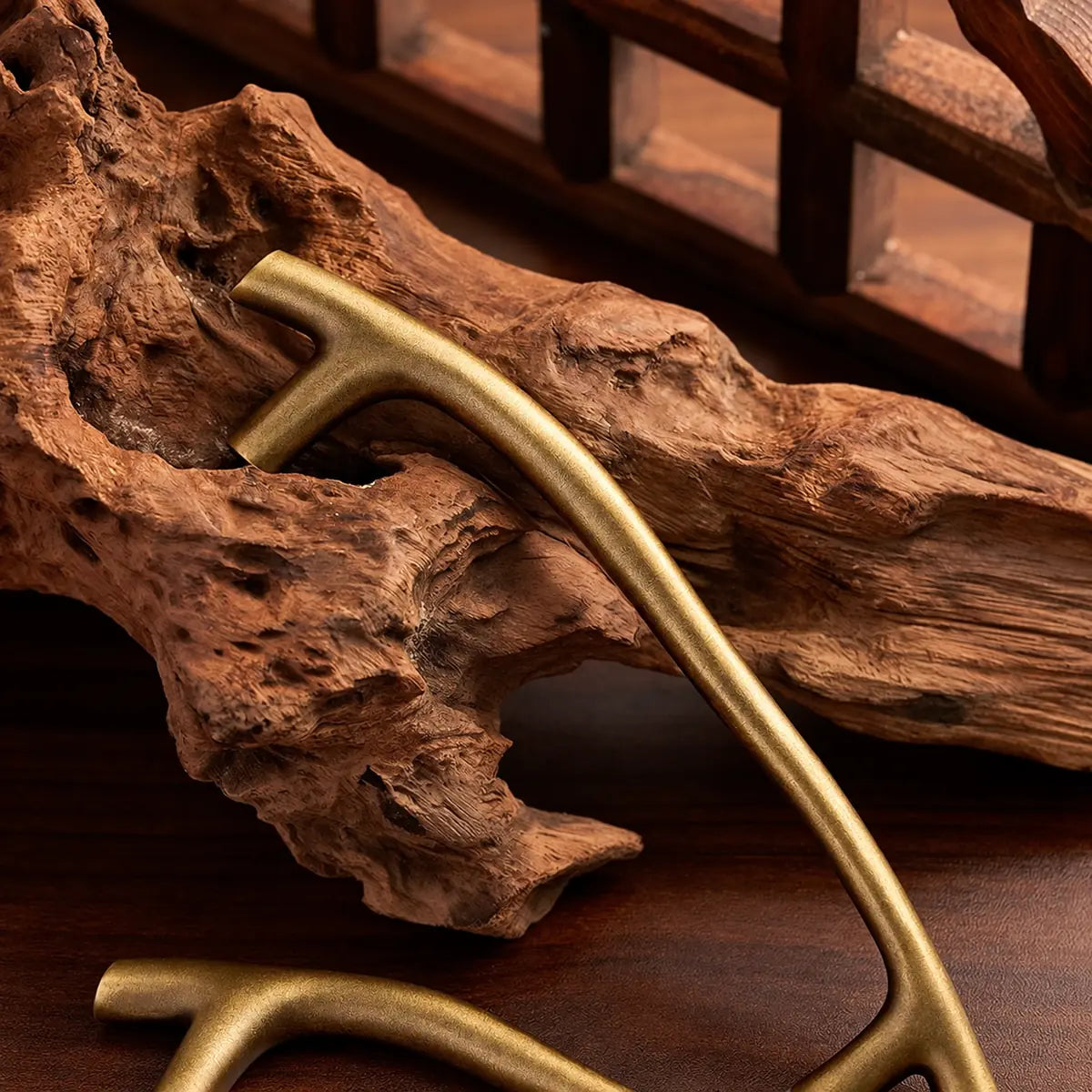 Close-up of the textured antique brass curved pull
