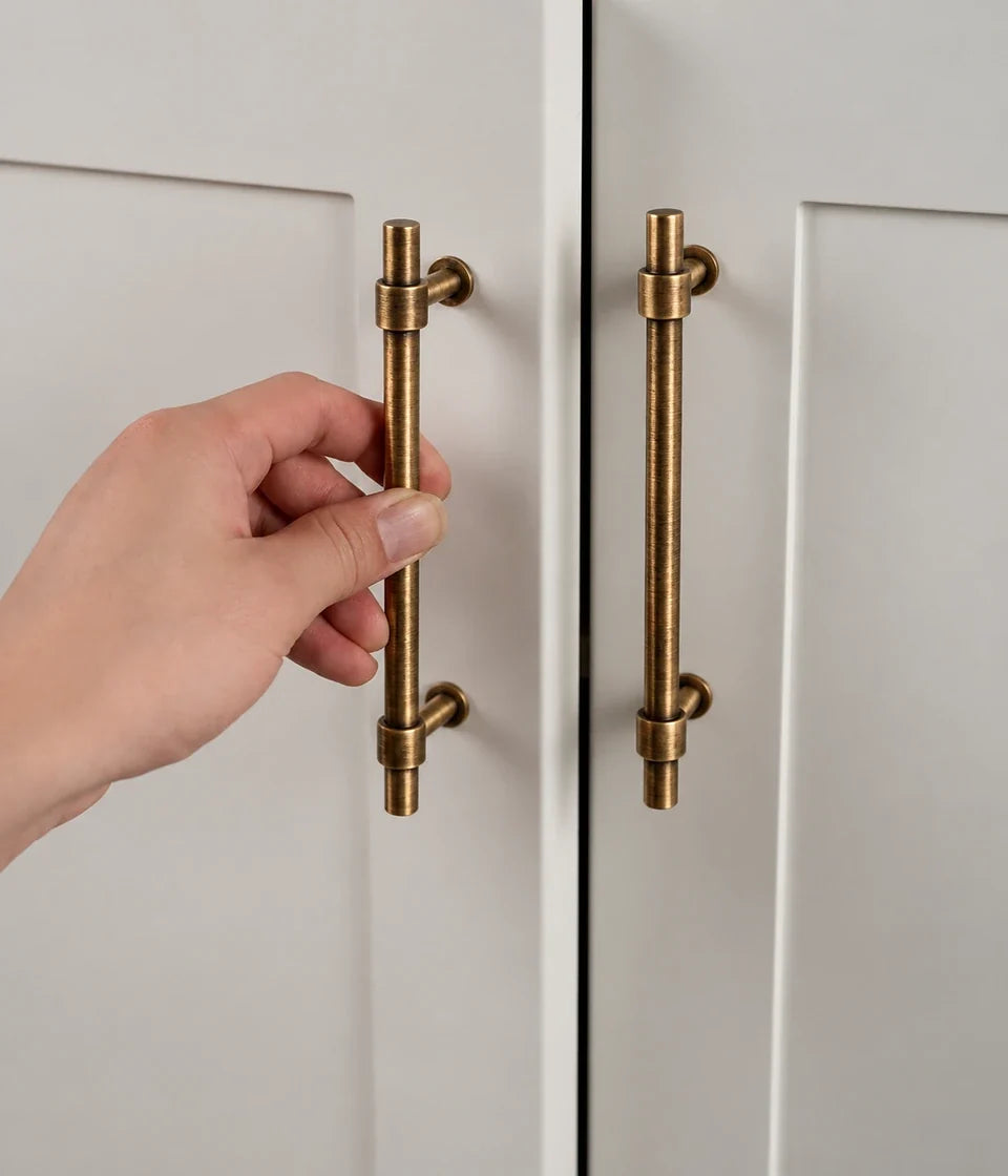 Cylinder cabinet hardware in antique brushed brass