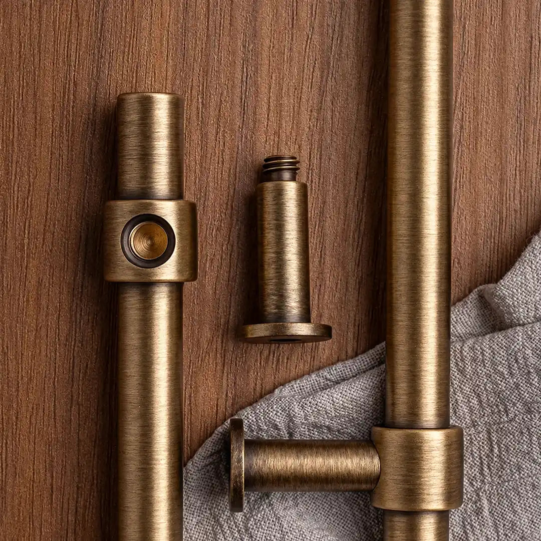 Rear mounting detail of an antique brass cylinder pull