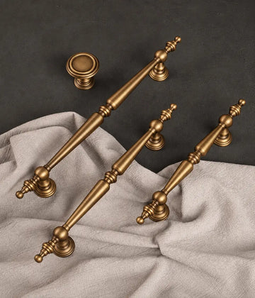 Antique brass finial cabinet pulls and round knob on linen