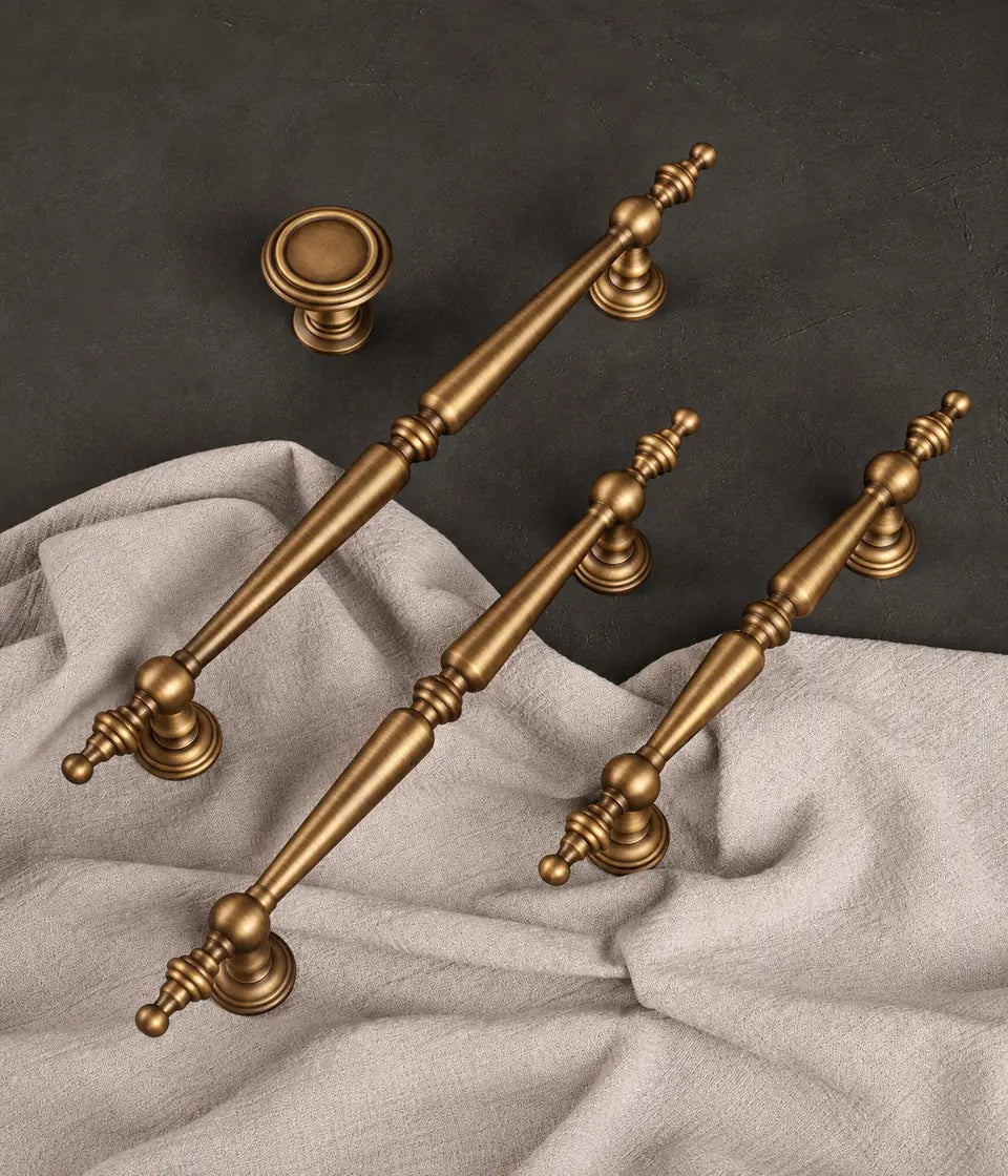 Antique brass finial cabinet pulls and round knob on linen