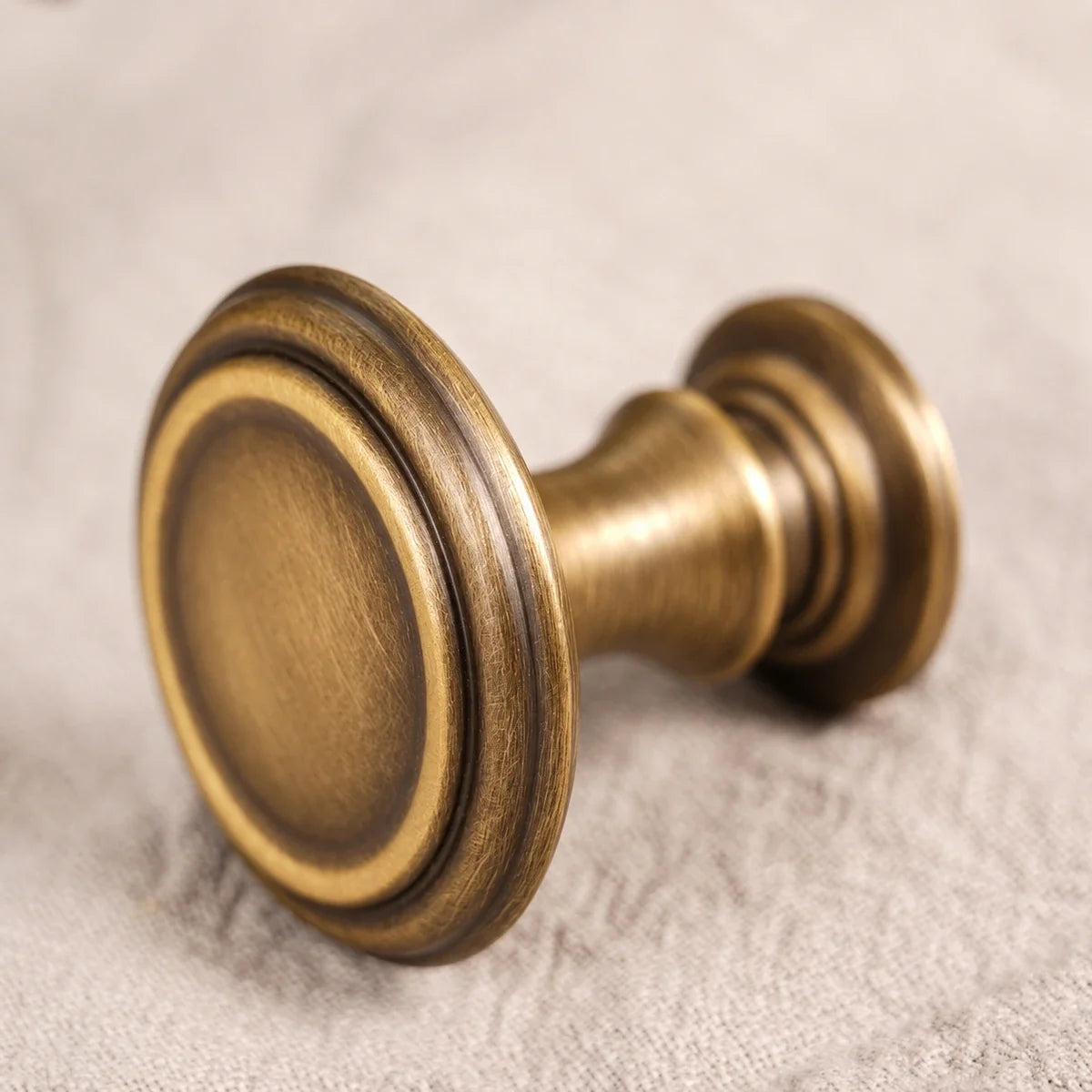 Brushed antique brass round knob close-up