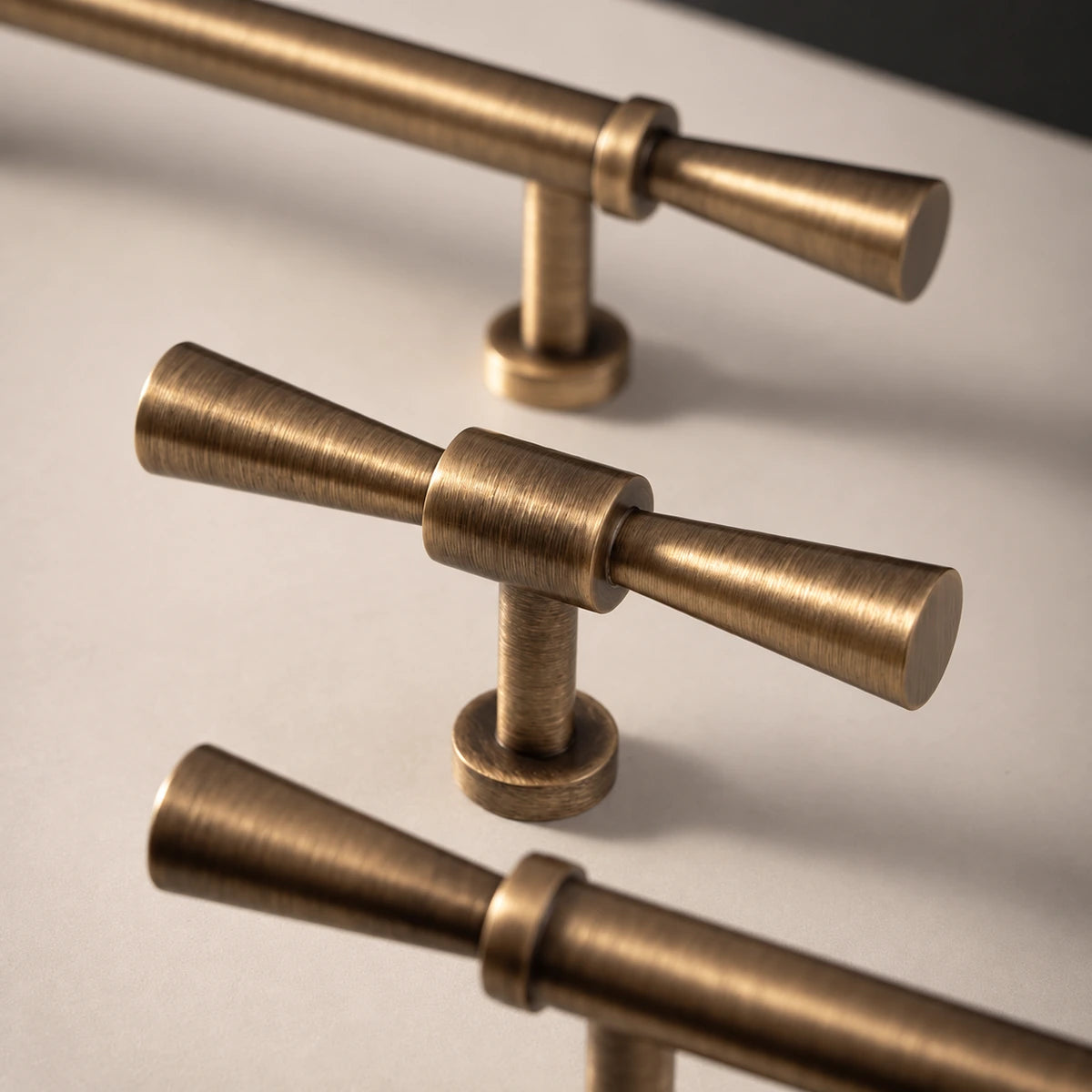 Close-up of flared T-knob arms, center collar and round mounting base
