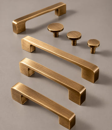Antique brass flat cabinet pulls with coordinating round disk knobs