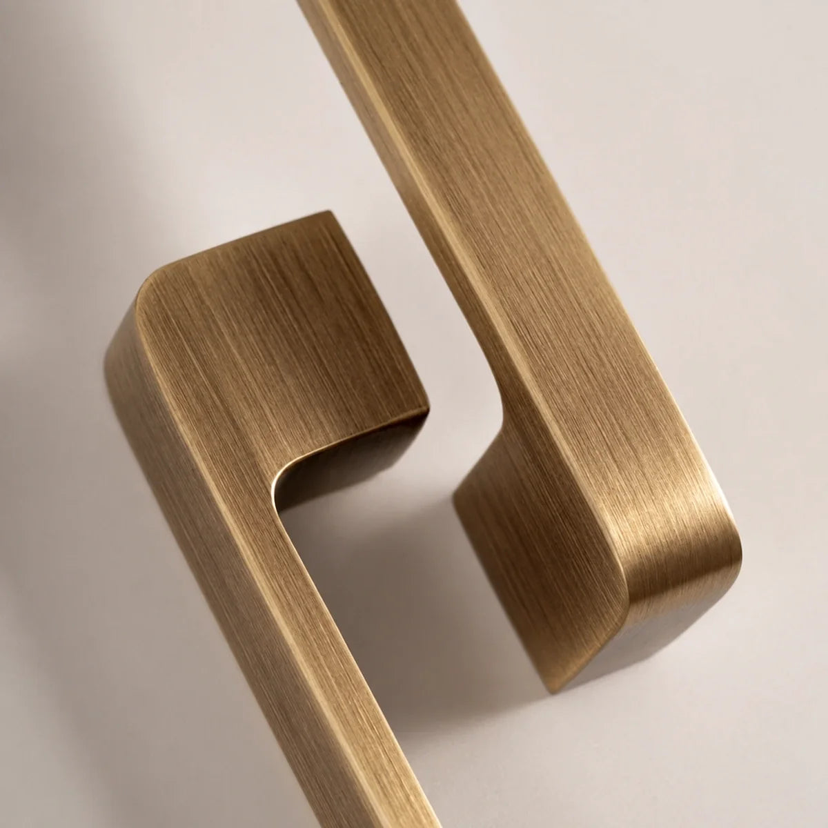 Flat cabinet pull corners and brushed brass surface detail