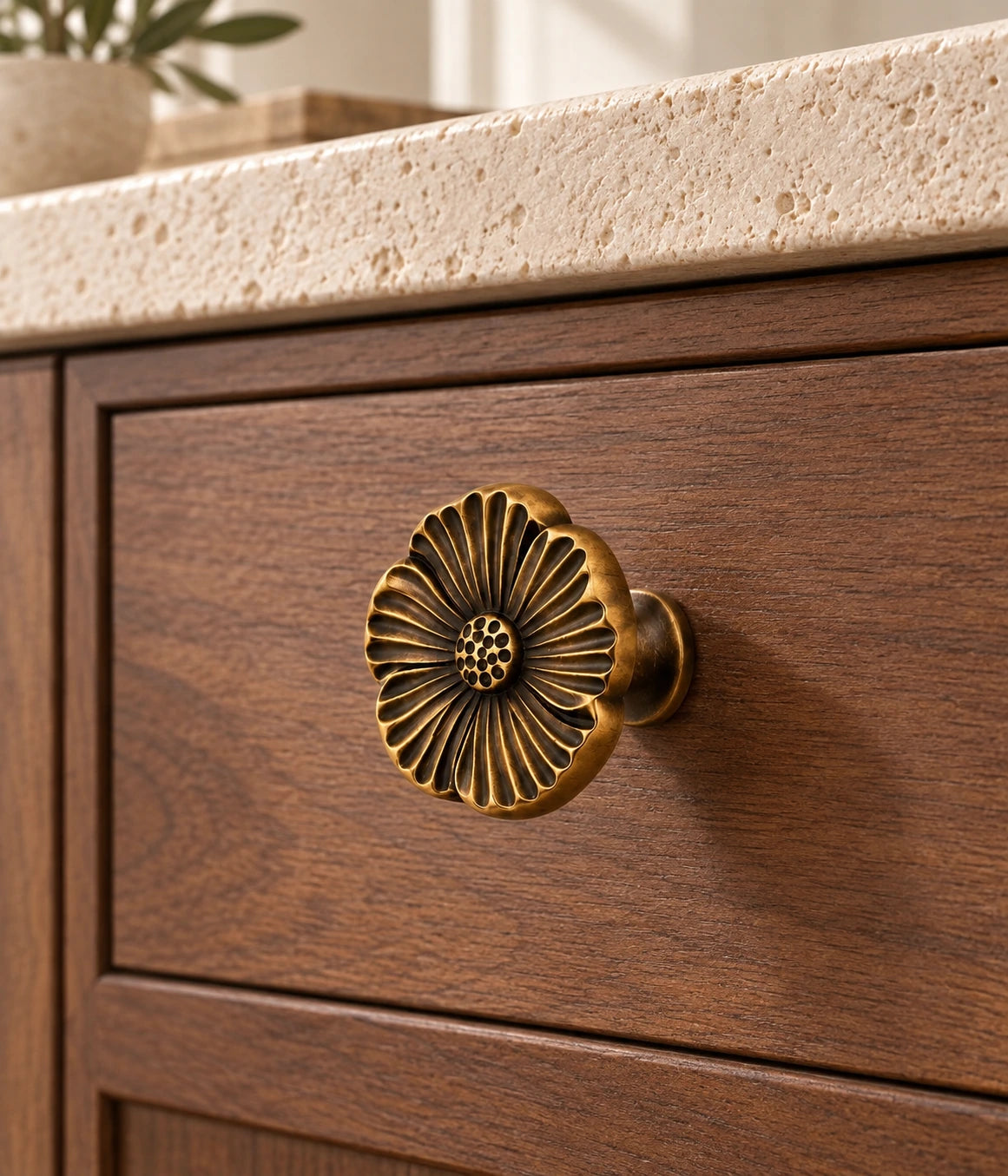 Antique Brass Grooved Flower Cabinet Knob installed on a cabinet drawer