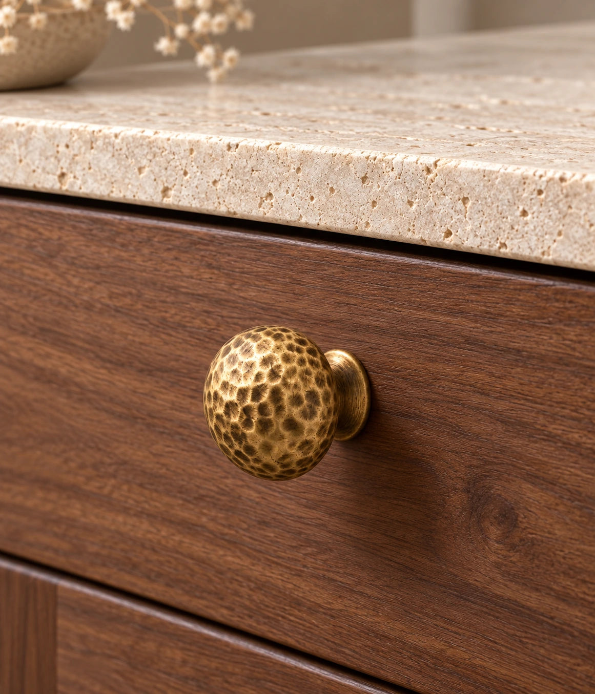 Antique Brass Hammered Mushroom Cabinet Knobs installed on a walnut cabinet drawer