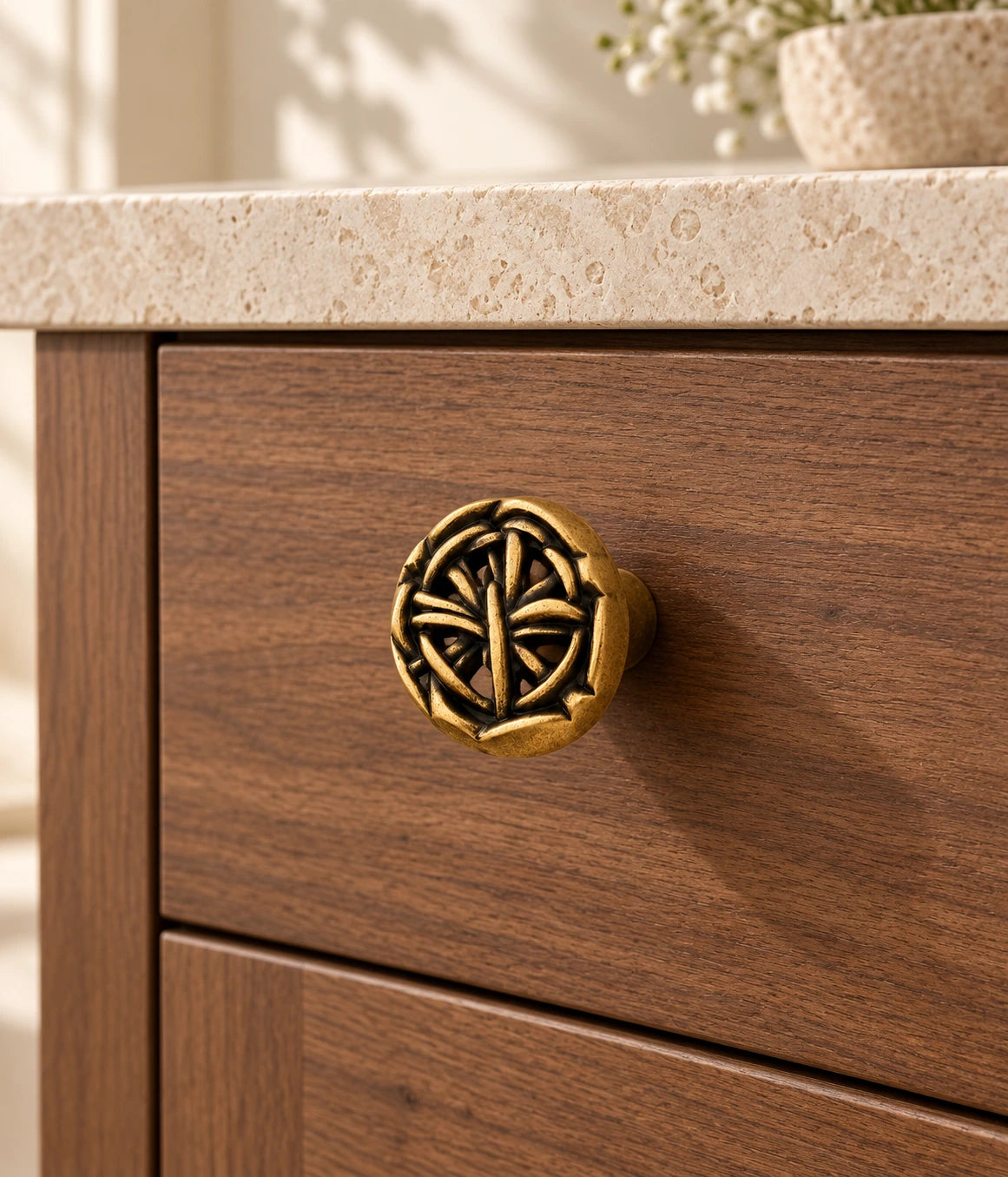 Antique Brass Openwork Weave Cabinet Knob installed on a walnut cabinet drawer