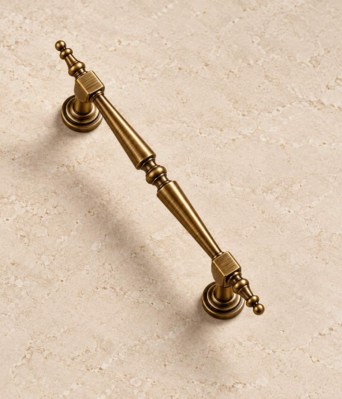 Antique Brass Ornate Cabinet Pulls, T-Knob & Floral Ring Pull on warm ivory limestone