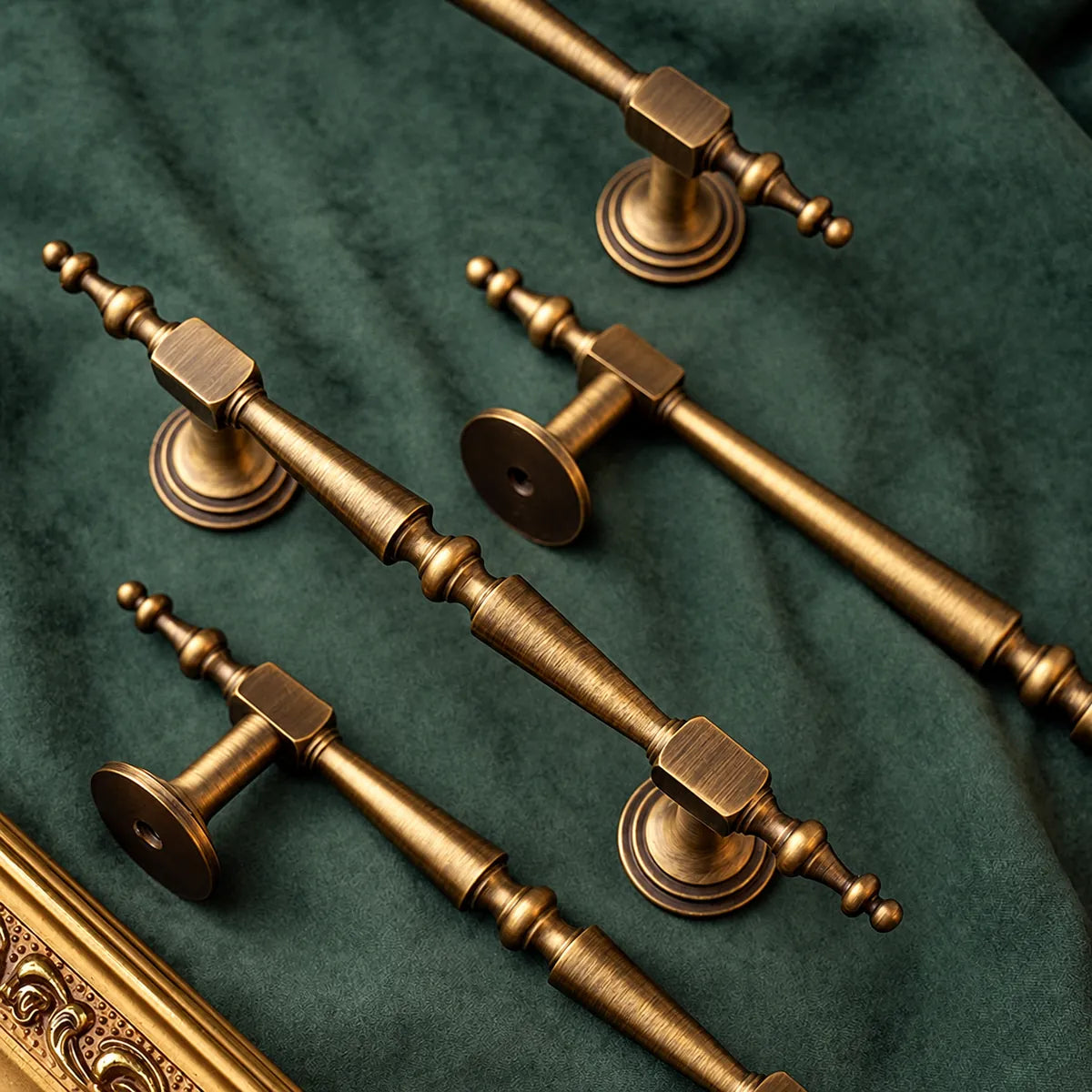 Antique brass ornate pulls showing stepped round bases and mounting holes